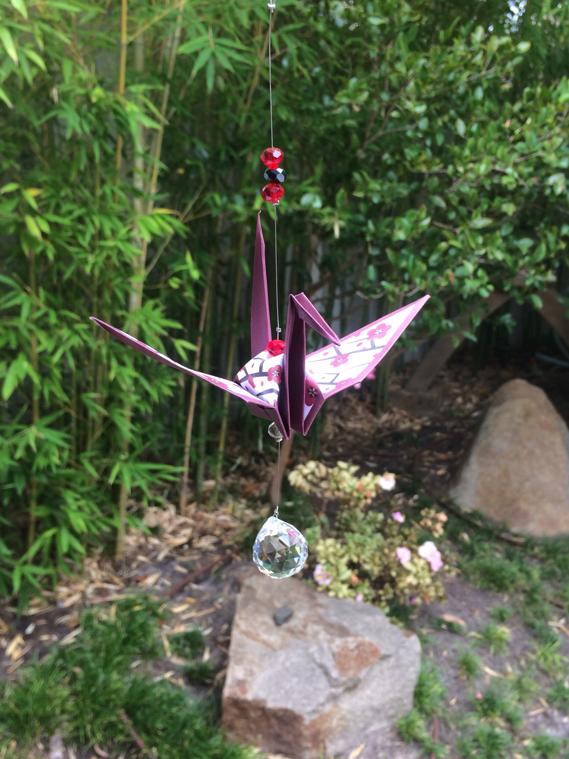 Origami crane suncatcher (plum flower)