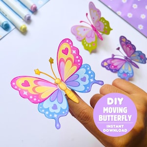 Peut inclure: Trois marionnettes à doigt papillon colorées avec des ailes roses, jaunes, violettes et bleues ornées de cœurs et d'étoiles. Les papillons ont des antennes jaunes avec des pointes en étoile. Un graphique violet contient le texte DIY MOVING BUTTERFLY INSTANT DOWNLOAD.