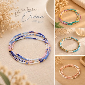 Op de afbeelding: Een collectie van meerstrengs kralenarmbanden met kleine glaskralen in tinten blauw, roze, wit en goud. De armbanden zijn in cirkelvormige patronen gerangschikt, waarbij sommige strengen effen kleuren hebben en andere afwisselende patronen tonen.