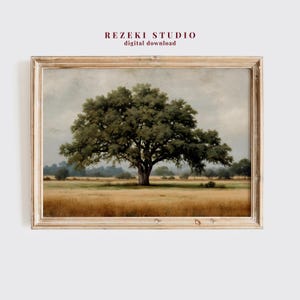 May include: A framed landscape print depicting a large oak tree in a field of golden grass under a cloudy sky. The print has a vintage aesthetic, with the text "REZEKI STUDIO digital download" at the top.