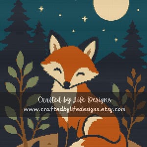 May include: A cross-stitch pattern featuring a stylized orange fox sitting in a forest at night under a full moon and stars. The text Crafted by Life Designs and www.craftedbylifedesigns.etsy.com is overlaid in white across the center of the image.