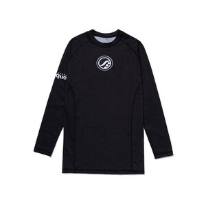 May include: Black long-sleeve athletic shirt with a crew neck. A white circular logo is on the chest, and the word "que" is on the left sleeve. The shirt is made of a stretchy, athletic material.