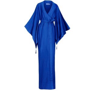 May include: A long, royal blue kimono-style robe with wide sleeves and a matching belt. The robe has a V-neck and is made of a flowing fabric. Tassels hang from the ends of the belt. The robe is designed for comfort and style.