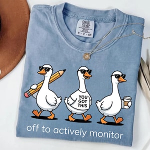 May include: A handmade wooden sign with the text "Welcome" in a handwritten style. The sign is painted white with a distressed finish and features a decorative floral design in shades of pink and green. It is designed for indoor or outdoor use.