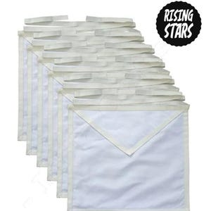 May include: A set of plain white ceremonial aprons with a triangular flap and white fabric ties, arranged in a layered stack. A black circular emblem with a scalloped edge features the white text Rising Stars in the upper right corner.