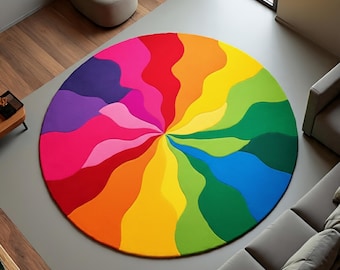 May include: A vibrant, circular area rug with a rainbow color scheme. The rug features a swirling design with sections of red, orange, yellow, green, blue, purple, and pink. The rug is a statement piece for any living space.