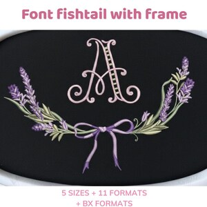May include: Black oval design with a light pink letter "A" in a fishtail font, surrounded by a lavender and green floral wreath and a purple bow. Text at the top reads "Font fishtail with frame".