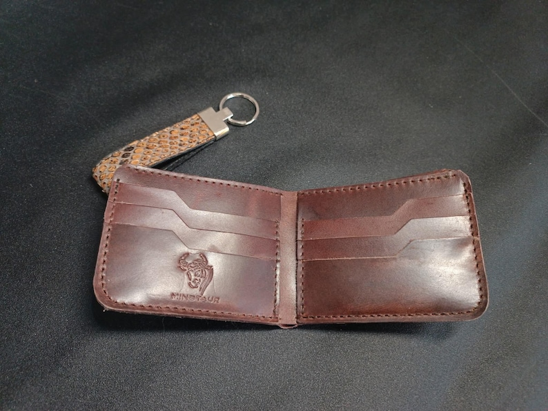 Rustic Textured Leather Wallet: "Rustic style bifold wallet for men featuring a distinctive patterned exterior and smooth leather pockets."
