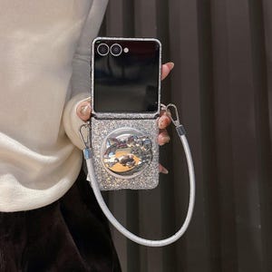 Silver Glitter Hello Kitty Phone Case with Strap, Compatible with Samsung Z Flip 7/6/5. Case +Strap + Grip