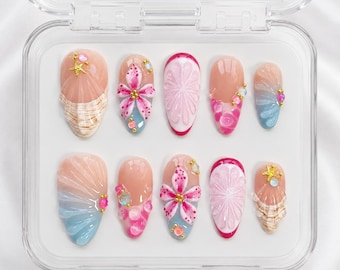 Appuyez sur les ongles floral pastel avec des strass et des étoiles de mer