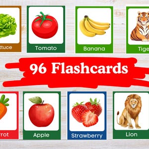 Op de afbeelding: Set van 96 flashcards met kleurrijke illustraties van verschillende soorten fruit, groenten en dieren. Bevat afbeeldingen van sla, tomaat, banaan, tijger, wortel, appel, aardbei en leeuw. Elke kaart is gelabeld.