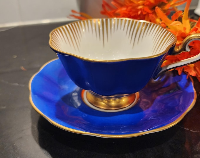 Featured listing image: Royal Albert Cobalt Blue & Gold Teacup and Saucer | Vintage English Bone China | Mid Century Gilt Sunburst Tea Cup