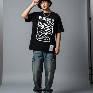 Schwarzes Oversize-Baumwoll-T-Shirt mit künstlerischem abstraktem Aufdruck | minimalistisches Unisex-Streetwear-Grafik-T-Shirt Graffiti
