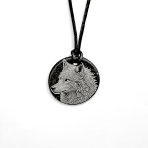 Handmade Welsh slate wolf pendant on black cord necklace.