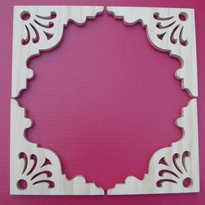 May include: Four unfinished wooden corner brackets with a decorative, scalloped edge and a floral design. The brackets are set against a bright pink background.