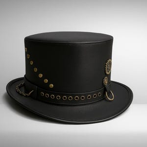May include: A black top hat with a wide brim. The hat features brass-colored rivets, a decorative chain, and gear-shaped embellishments. The hat has a steampunk aesthetic.