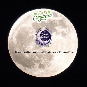 May include: A full moon with the text "100% Organic" and a logo that says "Lunar Goddess Essentials". The text "Handcrafted in Small Batches &bull; Toxin-Free" is also visible. The image is set against a black background.