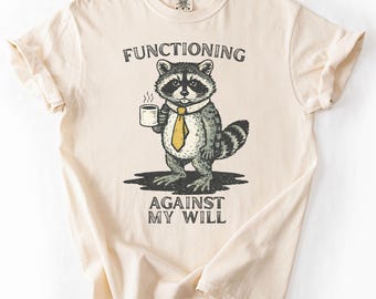 Gegen meinen Willen Waschbär T-Shirt Lustiges sarkastisches T Shirt Schwarzer Humor T-Shirt Introvertiertes Grafik-Shirt Anti soziales Zitat Shirt niedlich aber verdreht