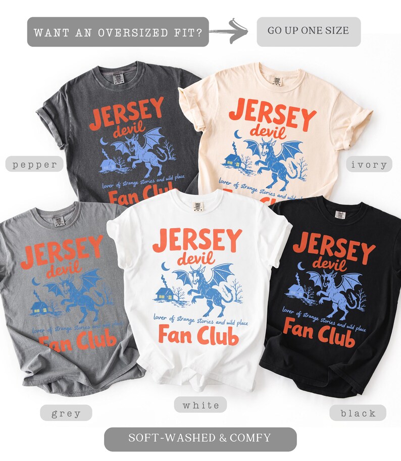 May include: A collection of soft-washed t-shirts in various colors, including pepper, ivory, grey, white, and black. Each shirt features the text "JERSEY devil" with a graphic of a mythical creature and the words "Fan Club".