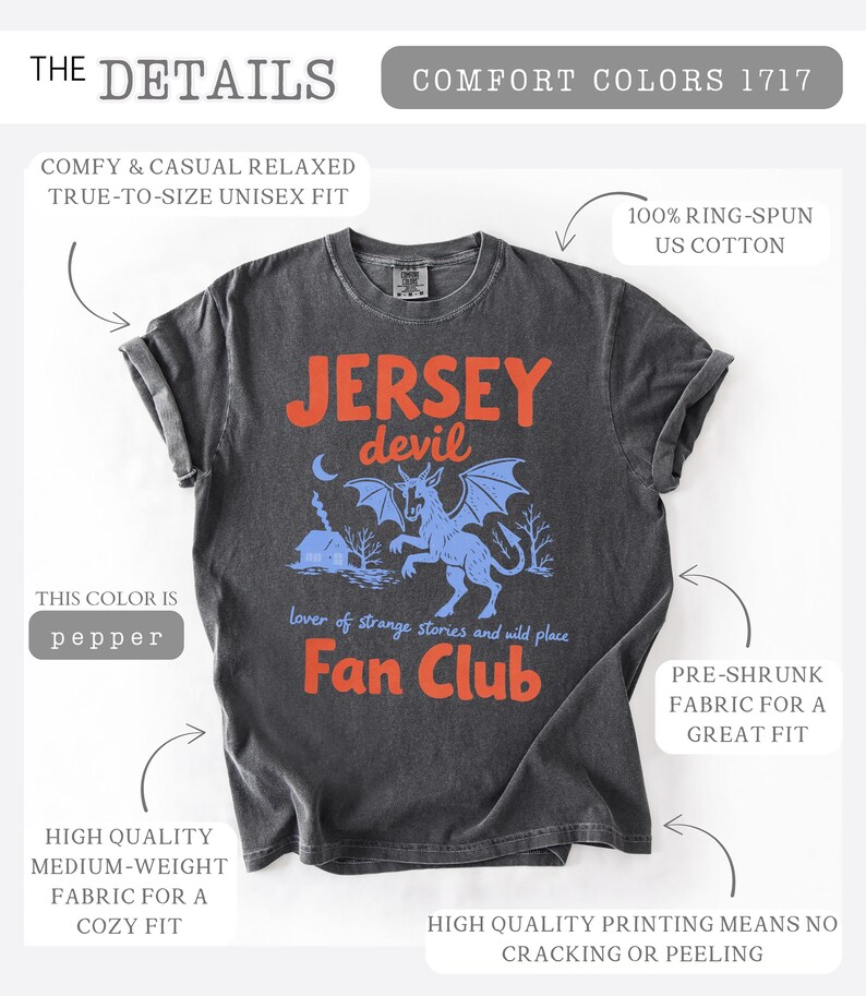 May include: Pepper-colored t-shirt with the text "Jersey Devil Fan Club" in orange. The design features a blue illustration of the Jersey Devil creature with a moon and trees. Made of 100% ring-spun US cotton, pre-shrunk for a great fit.