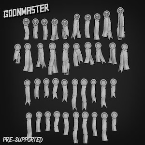 May include: A series of grey ribbon-like objects, each featuring a circular medallion and a skull motif. The text "GOONMASTER" is at the top, and "PRE-SUPPORTED" is at the bottom. The objects are arranged in rows against a dark background.