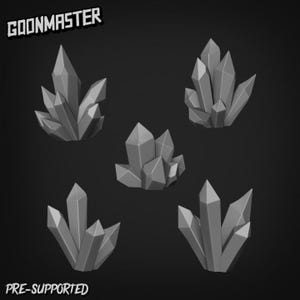 May include: Five grey crystal clusters are displayed against a dark backdrop. The crystals feature sharp, geometric forms and vary in size. The text "GOONMASTER" is in the top left corner and "PRE-SUPPORTED" is in the bottom left corner.