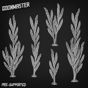 May include: A grayscale image showing six stylized plant models. The plants have long, slender leaves and are mounted on small, textured bases. The text "GOONMASTER" and "PRE-SUPPORTED" are displayed in the upper left and lower left corners, respectively.