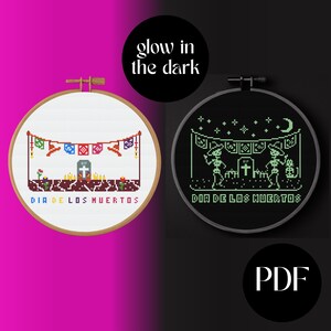 May include: Two cross-stitch embroidery hoops, one in a wooden hoop and the other in a black hoop. The left hoop features a colorful Day of the Dead design with the text "DIA DE LOS MUERTOS". The right hoop glows in the dark and has a similar design.
