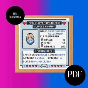 May include: A framed cross-stitch with a pixelated baby design and the text "NEW PLAYER UNLOCKED." The baby's stats are displayed: weight 3.4 kg, height 53 cm. The frame is light brown.