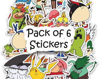 Op de afbeelding: Een pakket van zes stickers met verschillende stripfiguren. De stickers zijn kleurrijk en hebben een witte rand. De tekst "Pack of 6 Stickers" staat in het midden.