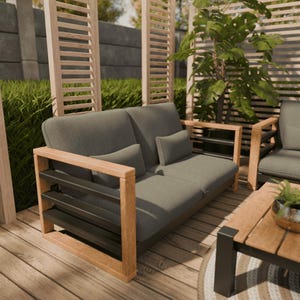 May include: A grey outdoor sofa with two cushions, set on a wooden deck. The sofa features a wooden frame with black detailing. A matching chair and coffee table are also visible, creating a coordinated outdoor seating area.