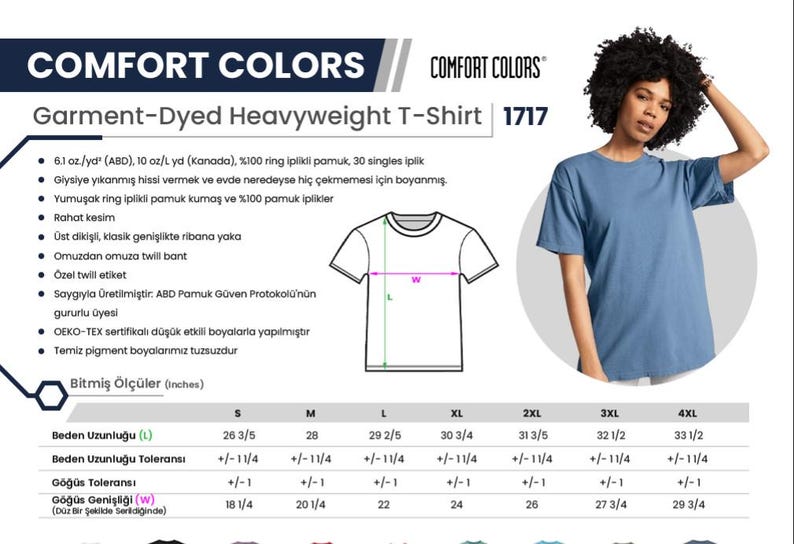 Puede incluir: Una mujer lleva una camiseta azul Comfort Colors Garment-Dyed Heavyweight. La imagen incluye una tabla de tallas con medidas en cm y detalles sobre la tela y la confecci&oacute;n de la camiseta.