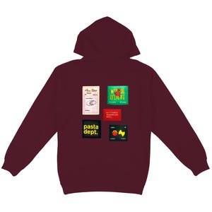 May include: A maroon hooded sweatshirt with various colorful patches. The patches include text and graphics such as "Pasta Dept." and "World of Delight."