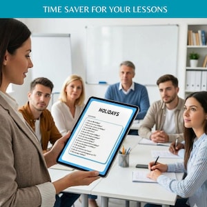May include: A digital tablet displaying a lesson plan titled HOLIDAYS with a list of questions, held by a person in a professional setting. The screen shows text about holiday topics, while a group of people sits at a table in the background.