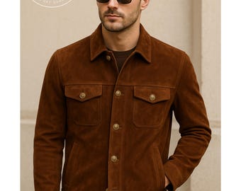 May include: A brown suede jacket with four front pockets and gold-colored buttons. The jacket has a classic collar and is worn over a brown shirt. The image includes a logo that says "PLANIO LEATHER" and "WHERE YOU GET QUALITY GOODS."
