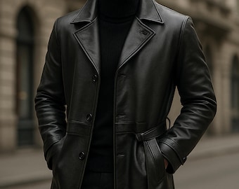 May include: A black leather trench coat with a belt, worn over a black turtleneck. The coat has a classic design with a notched collar and button closure. The image includes the text "PLANIO LEATHER" in a circular logo.