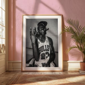 Mock-up of Michael Jordan wall art. Black and white poster for a vintage wall decor style. Perfect for bedroom decor, dorm room decor or decor in any part of your home. Print, frame and enjoy!