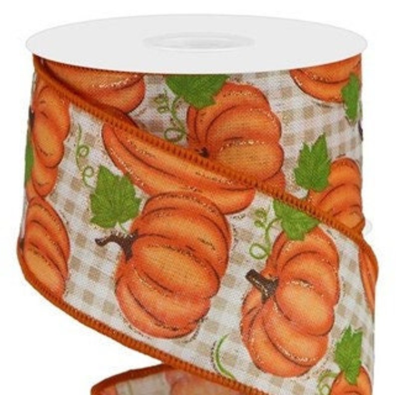 May include: Orange and green patterned ribbon with a gingham background featuring pumpkins. The ribbon is 2.5 inches wide.