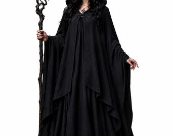 May include: A floor-length black hooded cloak with wide sleeves and a layered front design, paired with a dark, twisted wooden staff. The garment features a simple clasp at the neckline and a full, flowing skirt that pools at the base.