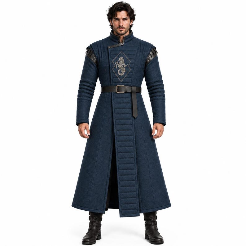 May include: A long, dark blue quilted coat featuring a high collar, structured shoulders, and a central vertical panel. A black belt with a silver buckle cinches the waist. An embroidered diamond-shaped emblem with a seahorse motif is on the chest.