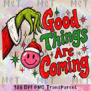 May include: A graphic illustration featuring a green, furry hand with a red and white sleeve holding a pink smiley face ornament wearing a Santa hat. The text reads Good Things Are Coming in red and green, surrounded by colorful star accents.