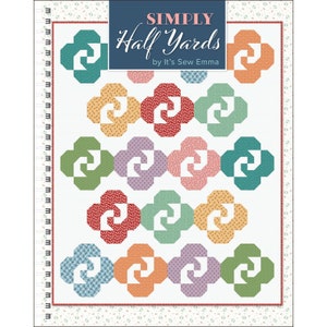 May include: A quilt pattern called "Simply Half Yards" by It's Sew Emma. The pattern features a white background with colorful, geometric shapes in a repeating pattern.