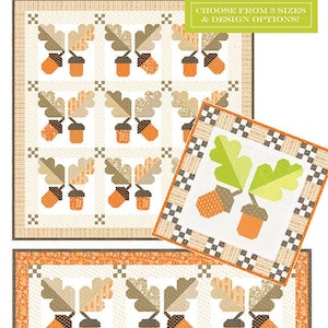 May include: A quilt pattern featuring an acorn and oak leaf design. The quilt has a cream background with orange, brown, and green accents. The text "Agatha's Oaks" is at the top. The pattern includes options for different sizes and designs.