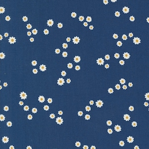 May include: A blue fabric with a white daisy pattern. The daisies are scattered randomly across the fabric.