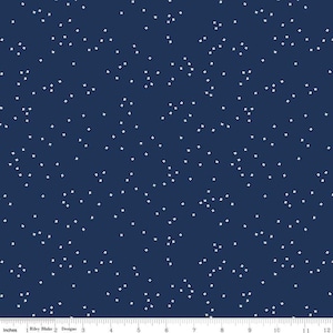 May include: A navy blue fabric with a white polka dot pattern. The dots are small squares.