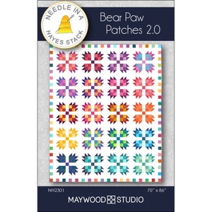 May include: A quilt pattern called "Bear Paw Patches 2.0" by Maywood Studio. The pattern features a colorful patchwork design with a white background. The pattern is 70 inches by 86 inches.