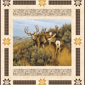 May include: A framed print of a scenic landscape with three deer in the foreground. The deer are brown with large antlers and are standing in a field of tall grass. The background is a hazy blue sky with mountains in the distance.