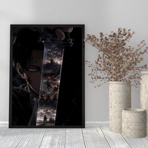 May include: A framed vertical wall art print featuring a dark, close-up illustration of a character with black hair and a serious expression. A large sword blade is held in the foreground, reflecting a detailed battle scene with figures and smoke.