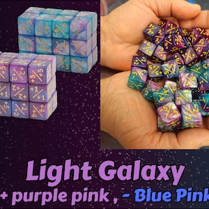 May include: An image showcases two sets of dice and a handful of dice. The dice are a mix of purple, pink, and blue hues with gold numbering. The text "Light Galaxy (+ purple pink, - Blue Pink)" is displayed at the bottom of the image.
