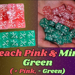 May include: A collection of peach pink and mint green dice with white markings. The dice are arranged in groups, with some displayed in a person's hand. The image includes the text "Peach Pink & Mint Green (+ Pink, - Green)".